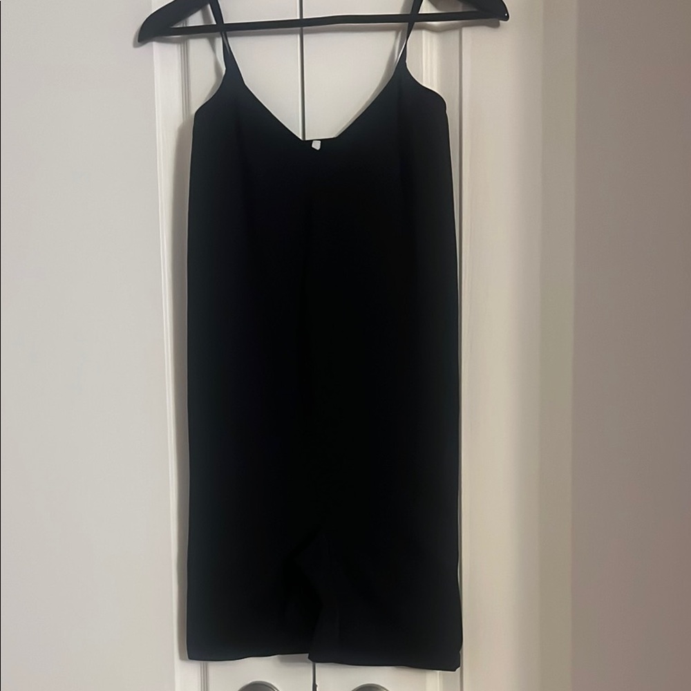 Black Sleeveless jumper. All one piece.